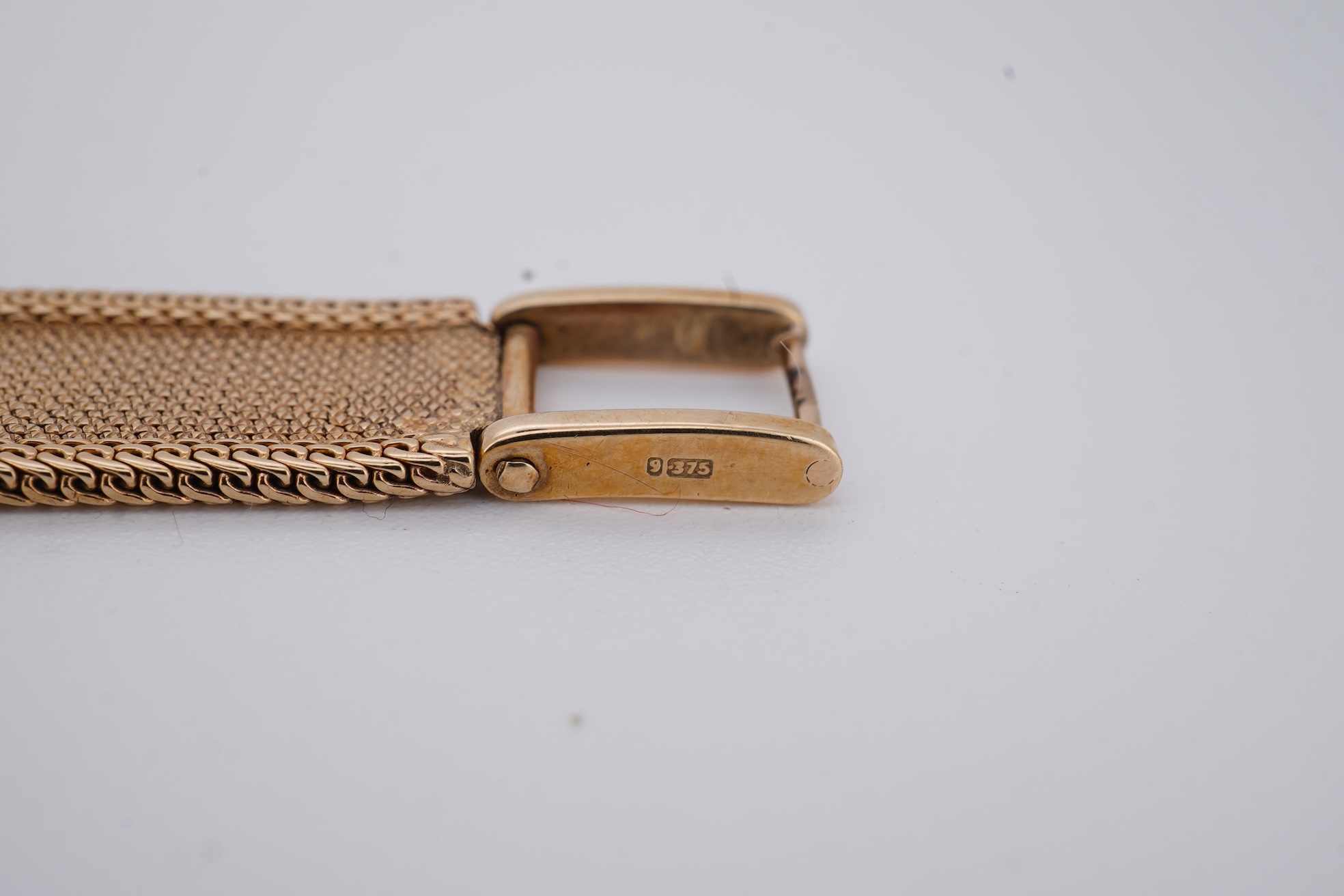 A lady's 1960's 9ct gold Rolex Precision manual wind wrist watch, with square dial, on an integral 9ct gold bracelet, the clasp with Rolex crown, overall length 15cm, gross weight 22 grams (bracelet a.f.)